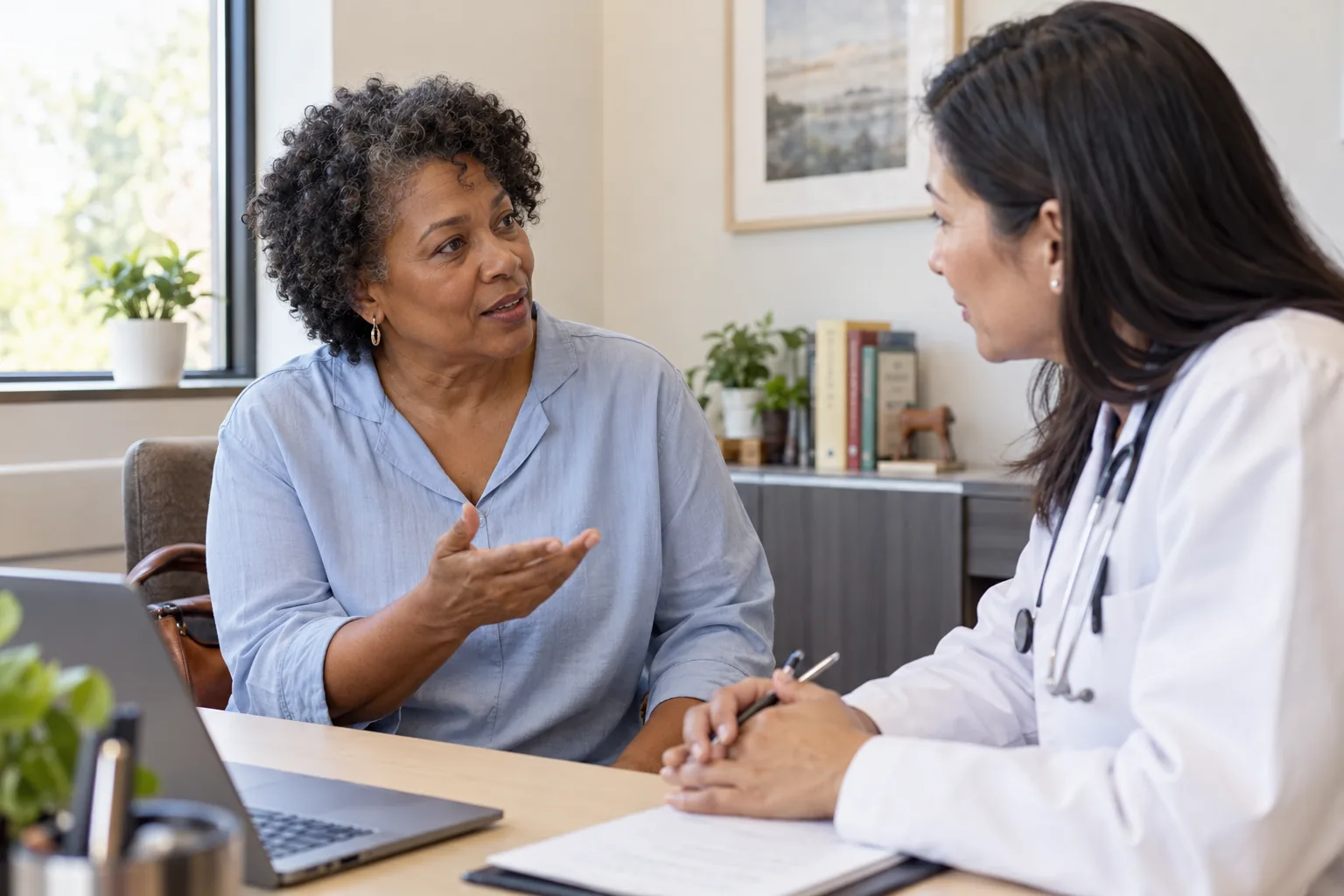 A woman discussing treatment questions with a clinician